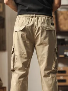 Stylish men's khaki multi-pocket cargo pants with elastic waist straight leg back view detail