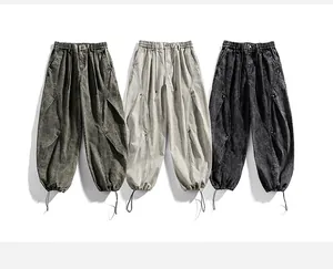 Detailed view of techwear cargo pants in three different washed colors