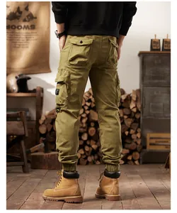 Back view showing functional multi-pockets and cuffed ankles of olive cargo joggers