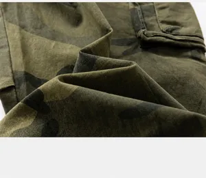 Close-up macro view of high-quality camouflage fabric texture for vintage cargo pants.