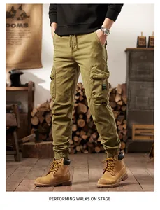 Detail view of men's vintage olive cargo pants with multi-pockets and jogger cuffs