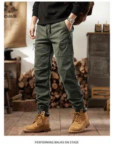 Detailed view of olive green cargo joggers with multiple pockets and drawstring waist