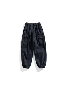 Men's techwear cargo pants with multiple pockets and elastic cuffs in washed black
