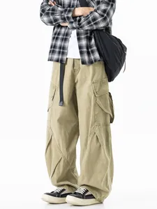 Men's loose fit khaki cargo pants with multiple pockets for a casual streetwear look.