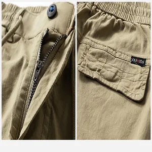 Vue détaillée du pantalon cargo kaki pour hommes avec fermeture éclair et poche latérale
