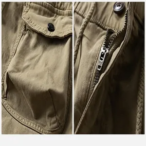 Close-up detail of khaki cargo pants showing pockets, zipper and fabric texture