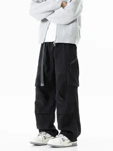 Men's loose black multi-pocket techwear cargo pants featuring a straight leg outdoor fit