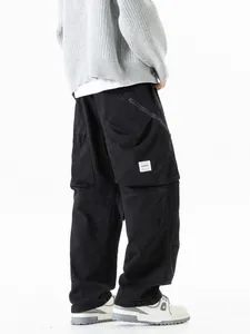 Men's loose multi-pocket mountain style cargo pants in black for outdoor fashion