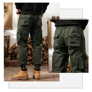 Rear view and pocket detail of men's olive green multi-pocket retro cargo jogger pants