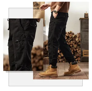 Close-up of black multi-pocket cargo pants for men in vintage outdoor style.