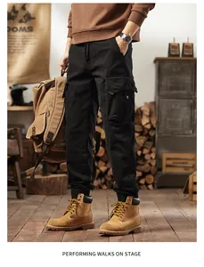Full view of men's vintage black cargo pants with a multi-pocket design and jogger style cuffs