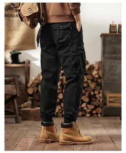 Back view of men's black vintage cargo pants featuring a multi-pocket design and elastic cuffs
