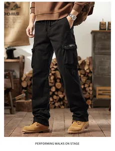Close-up view of men's black vintage cargo pants showing the multi-pocket outdoor design