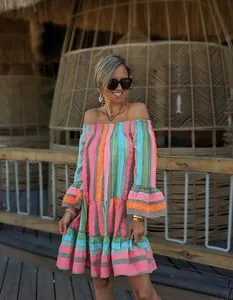 Vibrant colorful patchwork off-the-shoulder vacation dress featuring flared ruffled bell sleeves.