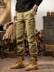 Men's American vintage olive green multi-pocket cargo jogger pants for outdoor mountain style.