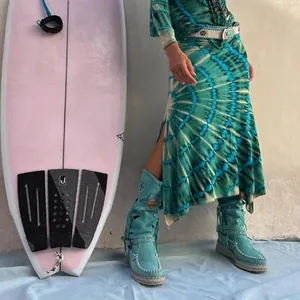 Bohemian tie-dye print maxi skirt with side slit, ideal for beach vacation style.