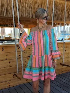 Bohemian off-the-shoulder resort dress with colorful geometric patterns and bell sleeves