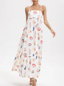 Detailed view of white tiered maxi dress featuring seashell and shell prints for summer