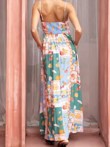 Back view of a tropical print Bohemian maxi dress with vibrant fruit patterns for vacation