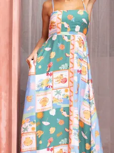 Detailed view of vibrant tropical print bohemian maxi dress for beach vacation