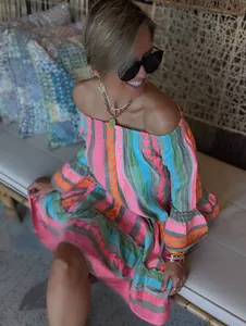 Colorful off-shoulder dress featuring patchwork bell sleeves and vibrant bohemian patterns