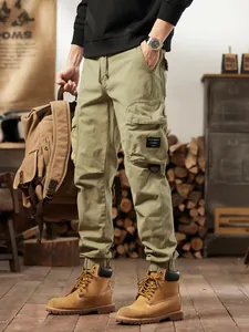Men's olive green multi-pocket cargo pants in American retro outdoor style jogger pants.