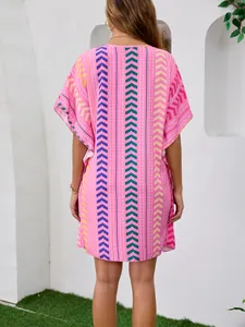 Back view of a pink bohemian printed kaftan dress featuring geometric chevron patterns.