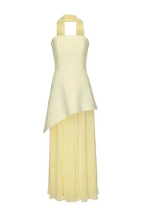 Detail view of an elegant pale yellow asymmetrical strapless gown with pleated maxi skirt