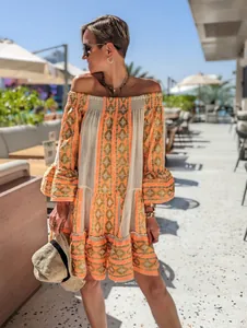 Stylish off-the-shoulder patchwork dress with geometric pattern and flare sleeves for resort