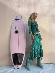 Stylish bohemian printed slit maxi skirt for beach vacation with vibrant tie-dye pattern.
