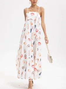 Elegant sleeveless white tiered maxi dress with colorful shell and conch sea print.