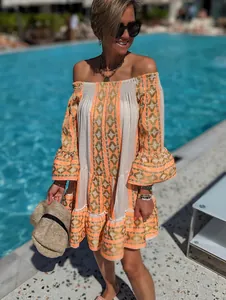 Bohemian off-the-shoulder embroidered resort dress with trumpet sleeves by the pool