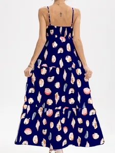 Back view of navy seashell print tiered maxi dress with thin adjustable spaghetti straps