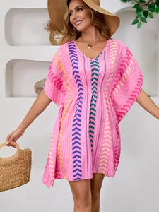 Bohemian printed V-neck dress with vibrant pink patterns and waist-cinching detail