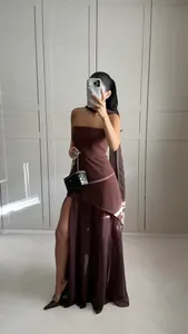 Elegant brown asymmetric bandeau dress paired with a matching flowing scarf detail.