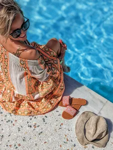 Bohemian style patchwork vacation dress with flare sleeves by the pool side
