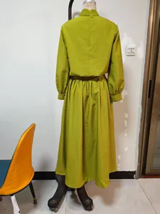 Rear view of autumn mustard green high-neck long-sleeve top and pleated maxi skirt set