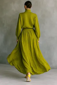 Back view of elegant lime green cotton linen long sleeve top and pleated maxi skirt set