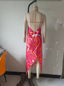 Detailed back view of a vibrant psychedelic print satin halter dress on a mannequin
