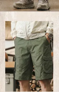 Detailed view of olive green cotton cargo shorts for men with functional side flap pockets