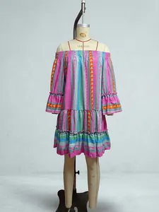 Colorful striped off-the-shoulder dress with flared sleeves on a display mannequin