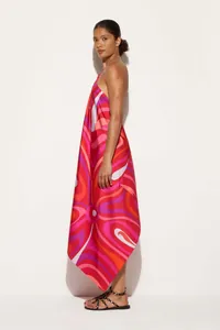 Detailed side view of abstract print satin halter dress with irregular hemline