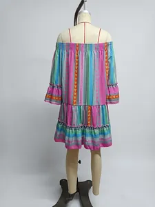 Detailed view of colorful boho print off-the-shoulder tiered mini dress on mannequin