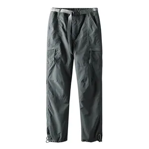 High-quality detail of men's quick-dry cargo pants with functional utility pockets