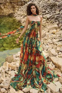 Full-length detail of a vibrant marble print maxi dress with a smocked tube top