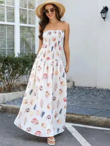 Elegant seashell print strapless maxi dress featuring a smocked bodice for beach vacations