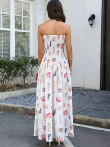 Back view of a strapless maxi dress featuring smocked bodice and seashell print.