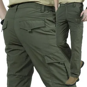 Detail view of men's olive green multi-pocket cargo pants showing rear and side fit.