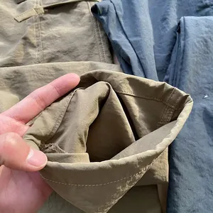 Close-up of quick-dry cargo pants leg cuff showing fine stitching and breathable fabric