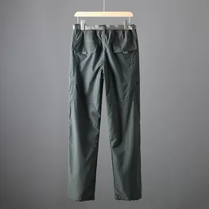 Back view of professional lightweight quick-dry cargo pants for men in dark grey finish